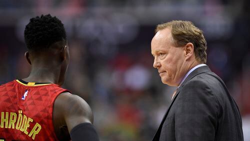 Atlanta Hawks head coach Mike Budenholzer, right, looks at Dennis Schroder during the first half in Game 5 of their playoff series against the Washington Wizards, Wednesday, April 26, 2017, in Washington.