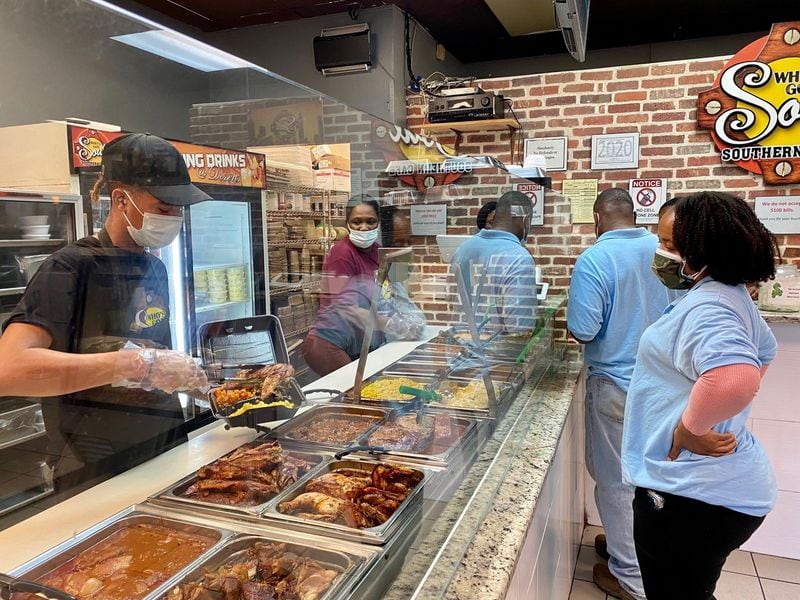 Customers consider the options at Who’s Got Soul Southern Cafe in Decatur. Wendell Brock for The Atlanta Journal-Constitution