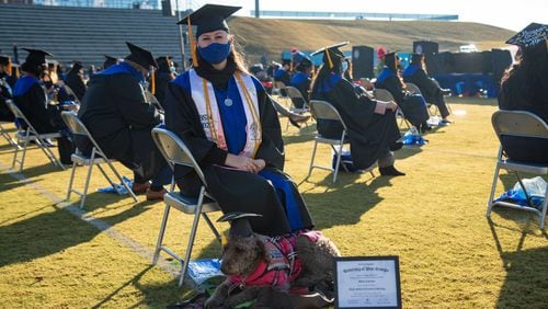 University of West Georgia student Maggie Leptrone with her dog, Mona, during the Dec. 5, 2020 commencement ceremony where she received a nursing degree. Mona, who came to all of Leptrone's classes because of the student's Type 1 Diabetes, received a "dog-ree" from the university. UNIVERSITY OF WEST GEORGIA