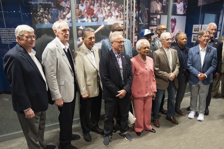 Billye Aaron poses for a photo with members of the 1974 Braves team before the opening of the Atlanta History Center exhibit “More Than Brave: The Life of Henry Aaron” on Monday, April 8, 2024.   (Ben Gray / Ben@BenGray.com)