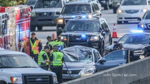 Police respond to a deadly accident on a metro Atlanta freeway that caused a massive back-up in both directions Thursday morning. A tire flew off a pick-up truck and struck a driver in the opposite lanes, killing her on the spot.