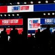 People attend the NBA basketball draft lottery in Chicago, Sunday, May 12, 2024. (AP Photo/Nam Y. Huh)