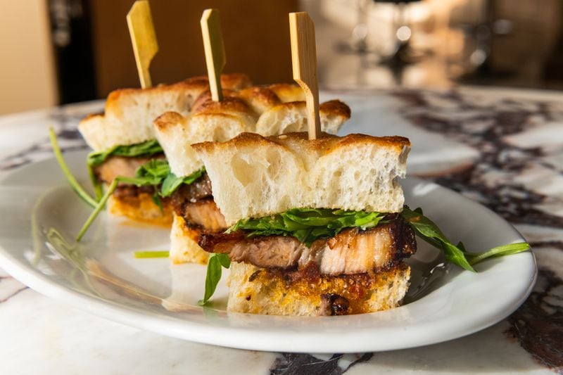 Panino di pancetta at Pendolino features pork belly, tomato jam and a bit of greenery stacked between sliced focaccia. Courtesy of Cassie Wright