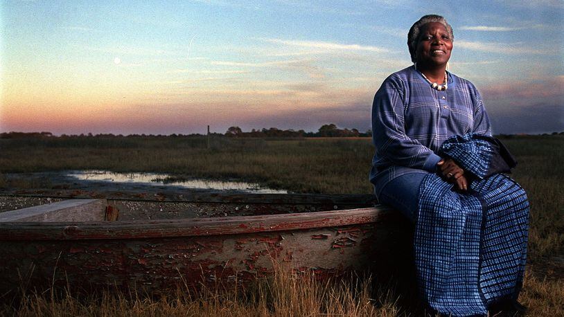 Cornelia Walker Bailey (cq) sits on a bateau on the edge of a Sapelo Island salt marsh. This bateau is one of the two traditional hand-made Geechee boats that still survives on the island. (BEN GRAY/STAFF)