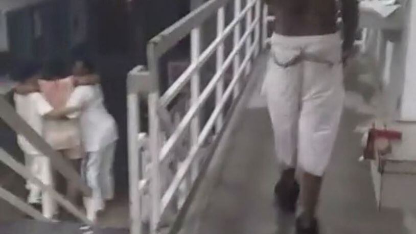 In a screen shot from Facebook video purportedly taken early Sunday morning at Ware State Prison, inmates help one of their own who was hurt in a riot.