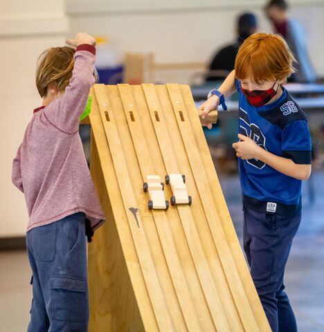 Cub Scouts building pinewood derby cars