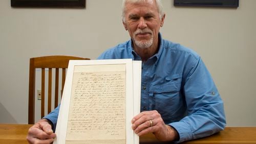 Craig Schneeberger with letter to his ancestor from President Abraham Lincoln. Credit:  Abraham Lincoln Presidential Library and Museum