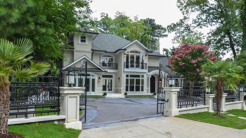 Ornate wrought iron accents add to the elegant entrance to this Buckhead estate.