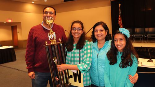 Arushi Cumer, age 13, holds her trophy after winning the 58th Georgia Association of Educators State Spelling Bee on Friday, March 15, 2019. She won on the word “andouille” in the 17th round.