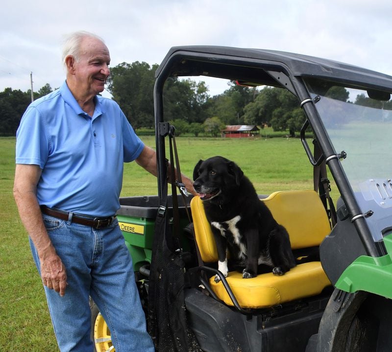 State Sen. Max Burns, R-Sylvania, and his rescue dog, Nugget, on the Burns family farm. (Courtesy photo)