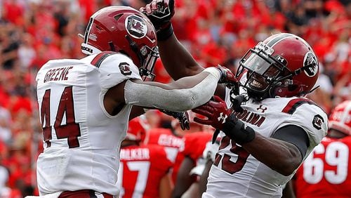 Sherrod Greene (44) and J.T. Ibe (29) of the South Carolina Gamecocks react after a missed field goal by Rodrigo Blankenship (98) of the Georgia Bulldogs in second overtime gave them a 20-17 win at Sanford Stadium on October 12, 2019 in Athens, Georgia. (Kevin C. Cox/Getty Images/TNS)