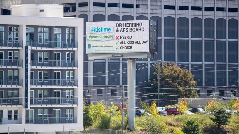 A billboard urging Atlanta Public Schools to give parents more options to send their child back to in-person classes is displayed in Midtown  on Oct. 1, 2020.  (Alyssa Pointer / Alyssa.Pointer@ajc.com)