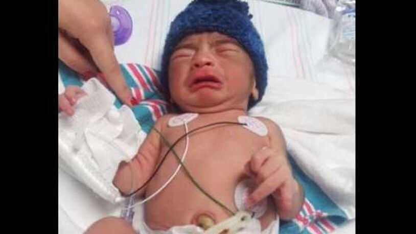 Chamblee police say this newborn boy was left outside a clinic in a gym bag.