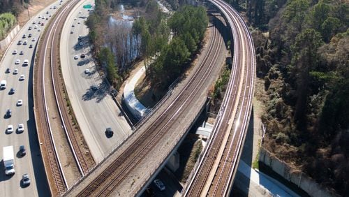 This aerial photo shows a new segment of PATH400, which is nearly complete but still closed, along Ga. 400 southbound on Dec. 19, 2019. The PATH400 through Buckhead is broken into two pieces, but this new section slated to open early next year will connect them, completing the ride through one of the busiest parts of Atlanta. New links like this are being forged in broken paths across metro Atlanta to create a regional network that could serve as an alternative to roads. HYOSUB SHIN / HYOSUB.SHIN@AJC.COM