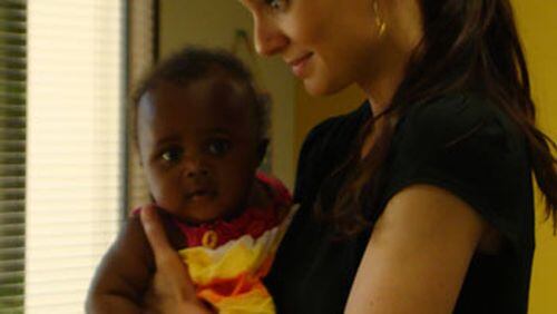 Sarah Wayne Callies visits International Rescue Committee in Atlanta in May. CREDIT: Rodney Ho/rho@ajc.com