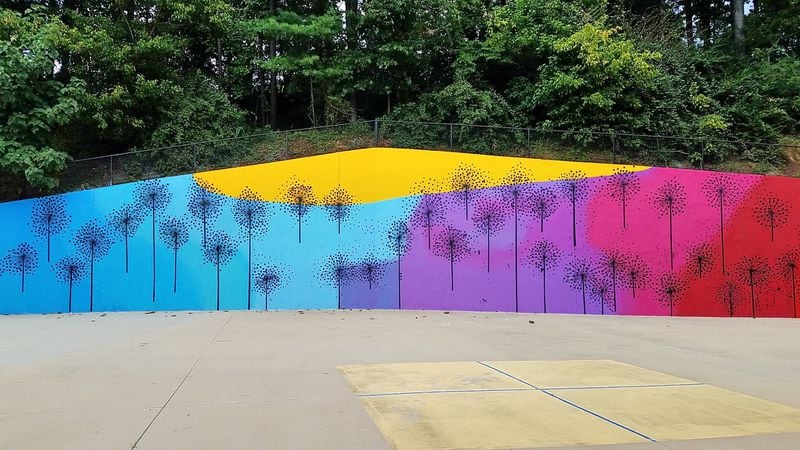 Lela Brunet enlivened the wall behind the Heards Ferry Elementary School, at 6151 Powers Ferry Rd., in Sandy Springs, with these melting colors. CONTRIBUTED: ART RUDICK