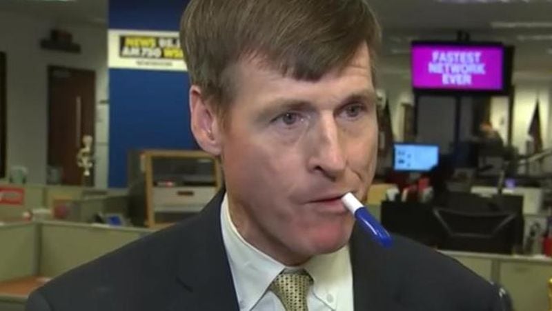 Doctors say a rare neurological condition is making it difficult for Washington correspondent Jamie Dupree's brain to tell his tongue what to do while speaking. Placing a pen in his mouth helps him speak. (Photo via WSBTV.com)