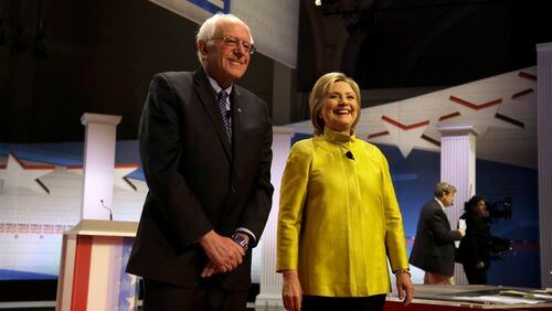 Democratic presidential candidates Bernie Sanders, left, and Hillary Clinton take the stage before a Democratic presidential primary debate at the University of Wisconsin-Milwaukee last week. AP/Tom Lynn