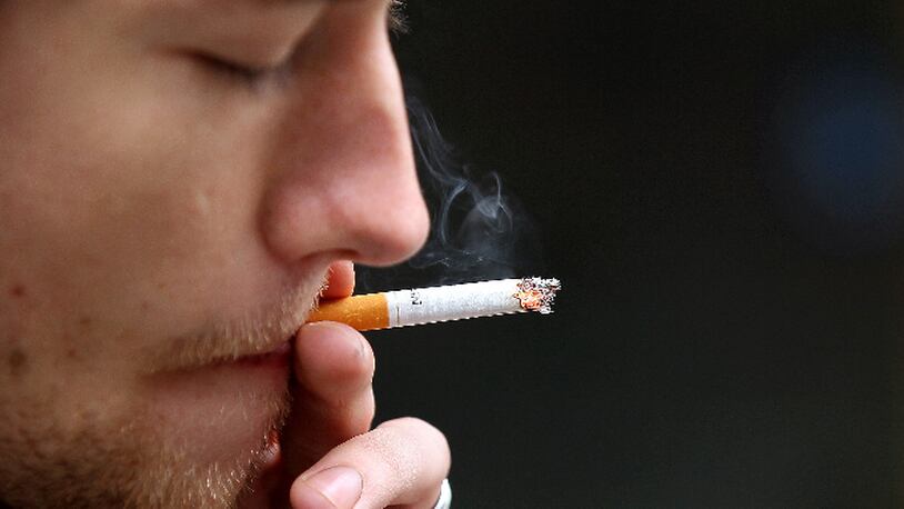 A man smokes a cigarette in front of the San Francisco Centre on May 31, 2011 in San Francisco, California.