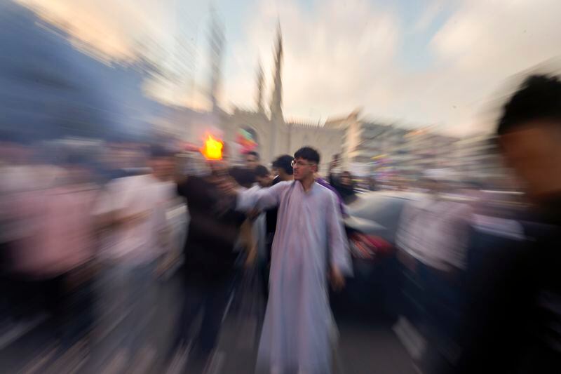 Muslims celebrate Eid al-Fitr, marking the end of the Muslim holy fasting month of Ramadan outside al-Seddik mosque in Cairo, Egypt, Wednesday, April 10, 2024. (AP Photo/Amr Nabil)