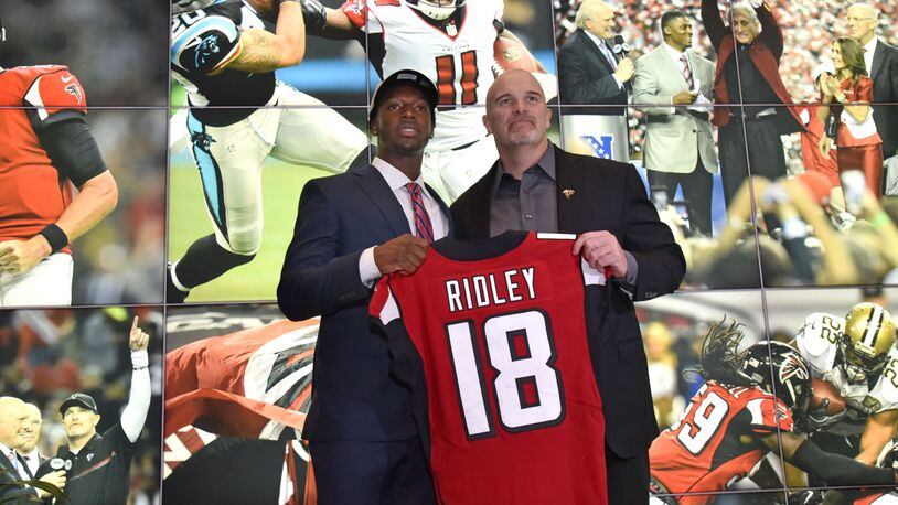 Falcons first-round pick Calvin Ridley poses with coach Dan Quinn during a press conference at the Falcons’ training facility.  The former Alabama wide receiver was selected by the Falcons with the 26th pick of the first round.