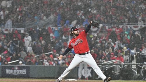 As the rain continues to come down, Atlanta Braves starting pitcher Ian Anderson delivers to a Houston Astros batter during the fifth inning in game 3 of the World Series at Truist Park, Friday October 29, 2021, in Atlanta. Hyosub Shin / Hyosub.Shin@ajc.com