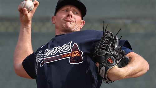 Braves pitcher Mark Melancon delivers a pitch working from the mound during spring training on Friday, Feb. 14, 2020, in North Port.  Curtis Compton ccompton@ajc.com