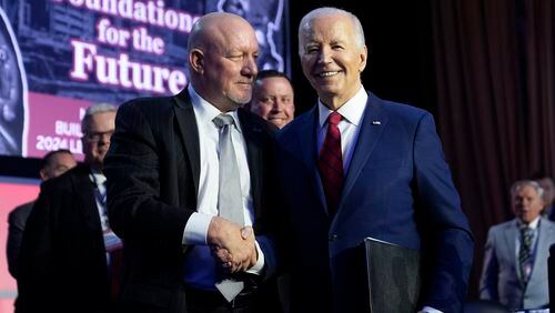 President Joe Biden talks with NABTU President Sean McGarvey after speaking to the North America's Building Trade Union National Legislative Conference, Wednesday, April 24, 2024, in Washington. (AP Photo/Evan Vucci)