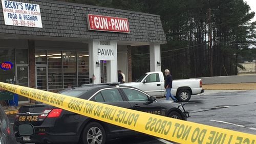 Two men attempted to rob Dixie Gun and Pawn on Dec. 26. A store employee shot one of the suspects, who died at the scene.