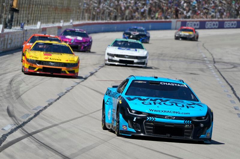 Ross Chastain (1) heads into Turn 1 during a NASCAR Cup Series auto race at Texas Motor Speedway in Fort Worth, Texas, Sunday, April 14, 2024. (AP Photo/Larry Papke)