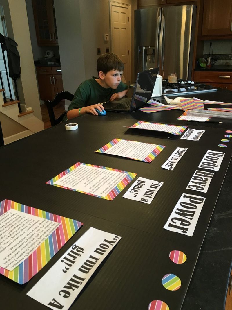 Bennett Stone, 10, shown working on a class project to show transgender individuals that their lives matter, is a wonderful example of being a good neighbor to others. He got the “love notes” idea after learning 41 percent of transgender individuals try to kill themselves at some point in their lives. CONTRIBUTED