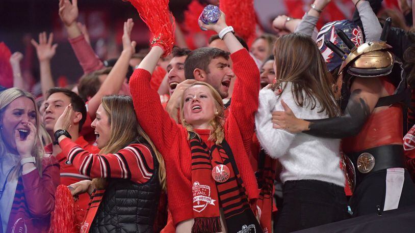 Georgia fans react in the second half during College Football Playoff National Championship at Mercedes-Benz Stadium. The Georgia Bulldogs didn’t win, but playing on the national sports stage can provide other benefits to universities. HYOSUB SHIN / HSHIN@AJC.COM