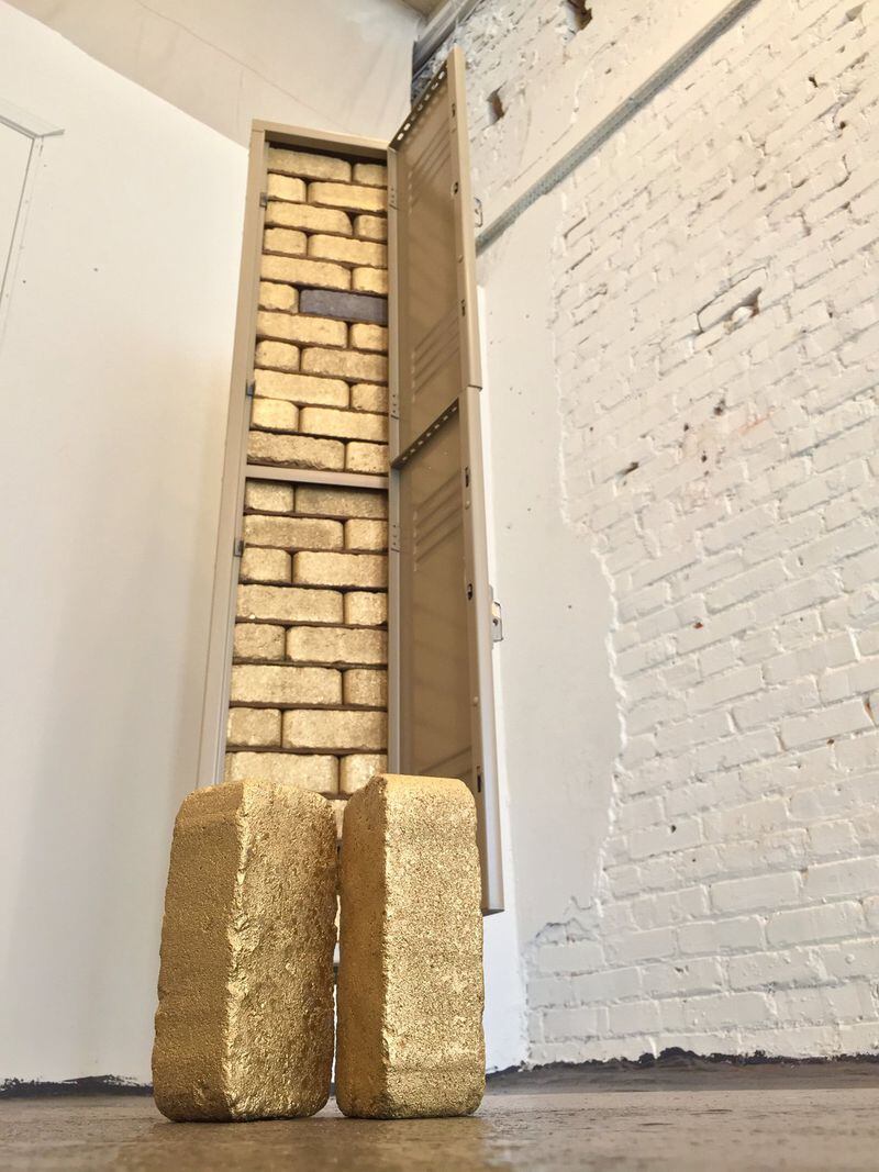 “Safe Keeping” (locker, gold spray paint, bricks, Masonite) by Atlanta emerging artist David Gabbard.