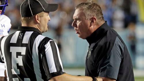 Georgia State coach Shawn Elliott confers with an official during the game against North Carolina in Chapel Hill, N.C., Saturday, Sept. 11, 2021. (AP Photo/Chris Seward)