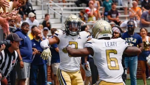 D.J. Moore celebrates his touchdown reception with Christian Leary during Georgia Tech's spring football game in Atlanta on Saturday, April 15, 2023.   (Bob Andres for the Atlanta Journal Constitution)
