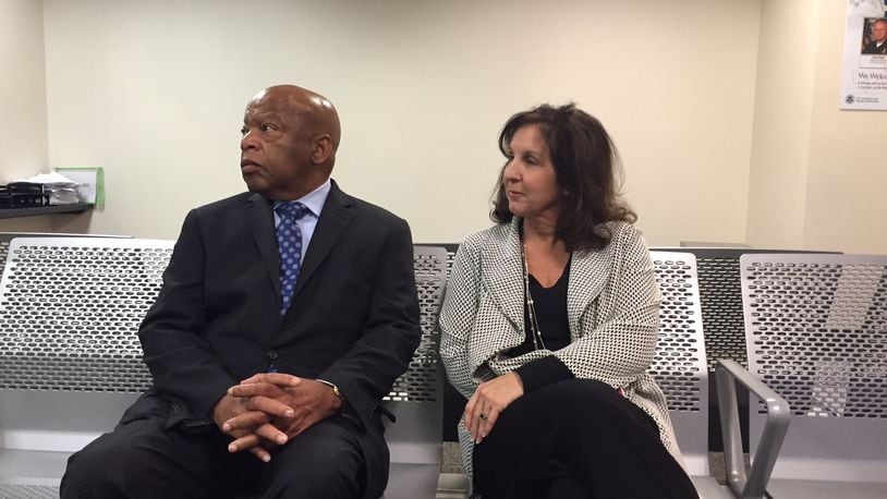 At first, a U.S. Customs and Border Protection official would not say how many people were being detained at Hartsfield-Jackson Atlanta International Airport Saturday following President Donald Trump’s executive order, U.S. Rep. John Lewis said. So Lewis turned to a gathering crowd of activists and attorneys at the airport and declared: “Why don’t we just sit down and stay a while.” JEREMY REDMON/jredmon@ajc.com