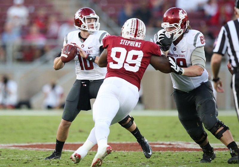 Jake Rodgers #69 of the Washington State Cougars blocks Terrence Stephens #99 of the Stanford Cardinal as Jeff Tuel #10 of the Washington State Cougars looks downfield for an open receiver at Stanford Stadium on October 27, 2012 in Palo Alto, California. (Oct. 26, 2012 - Source: Tony Medina/Getty Images North America