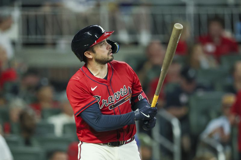 Atlanta Braves catcher Travis d'Arnaud hits a home run during the fifth inning against the Texas Rangers at Truist Park, Friday, April 19, 2024, in Atlanta. This was the second of three home runs hit by d'Arnaud. (Jason Getz / AJC)
