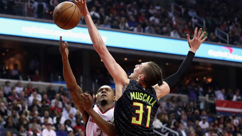 WASHINGTON, DC - APRIL 19: Mike Muscala #31 of the Atlanta Hawks blocks a shot by Bradley Beal #3 of the Washington Wizards in the first half of Game Two of the Eastern Conference Quarterfinals during the 2017 NBA Playoffs at Verizon Center on April 19, 2017 in Washington, DC. NOTE TO USER: User expressly acknowledges and agrees that, by downloading and or using this photograph, User is consenting to the terms and conditions of the Getty Images License Agreement. (Photo by Rob Carr/Getty Images)