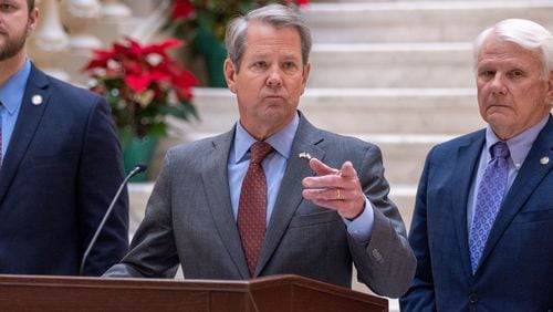 Gov. Brian Kemp speaks at a press conference at the Capitol in Atlanta on Monday, Dec. 18, 2023, announcing that he will provide a $1,000 retention bonus to state employees, teachers and school support staff this holiday season. (Arvin Temkar/The Atlanta Journal-Constitution/TNS)
