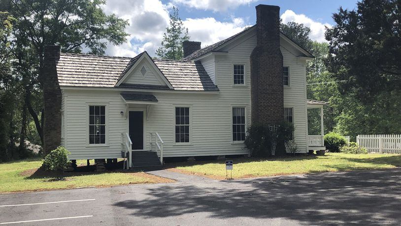 The Wynne-Russell House is listed on the National Register of Historic Places and is reported to be the oldest pioneer home in Lilburn. Side view of the Plantation Plan architectural style of the Wynne-Russell house built in the 1800s. Photo by Kathryn Kickliter.