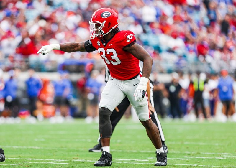 Georgia outside linebacker Robert Beal Jr. (33) makes sure his teammates are lined up correctly during the Bulldogs' game against Florida at TIAA Bank Field in Jacksonville, Fla., on Friday, 28, 2022. (Photo by Tony Walsh/UGA Athletics)