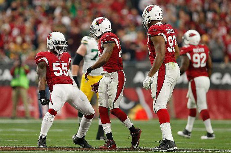 Linebacker Sean Weatherspoon (55) and strong safety Deone Bucannon (20) of the Arizona Cardinals celebrate against the Green Bay Packers at the University of Phoenix Stadium on December 27, 2015 in Glendale, Arizona. (Photo by Christian Petersen/Getty Images)
