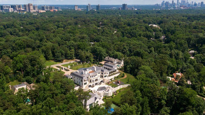 An aerial photo shows a Buckhead neighborhood and the Atlanta skyline. (Hyosub Shin / Hyosub.Shin@ajc.com)