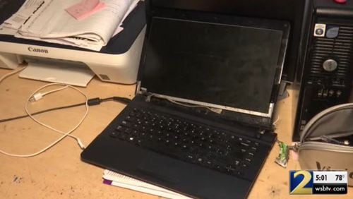 This damaged laptop was part of the loss suffered by a Gwinnett County woman who advertised a car for sale on Craigslist.