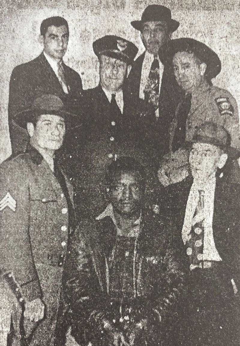 Carrollton sharecropper Clarence Henderson photographed moments before his one-day trial on Jan. 30, 1950, for the murder of Carl "Buddy" Stevens, Jr. surrounded by state and local law enforcement. The trial was a spectacle and held under tight security with armed state troopers ringing the courtroom.