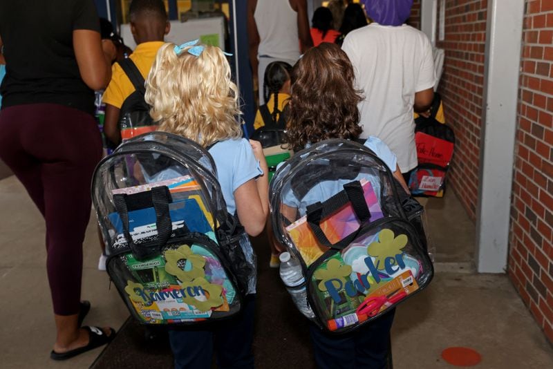 Clayton County students carry mandatory clear bookbags on the first day of school in August 2022. The district instituted the policy after struggling with weapons on campus. (Jason Getz / Jason.Getz@ajc.com)