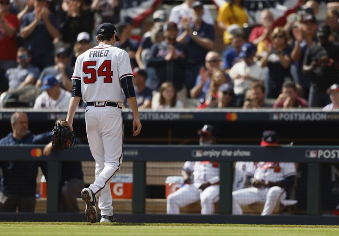 Atlanta Braves' Brian Snitker removes Max Fried during the fourth inning of game one of the baseball playoff series between the Braves and the Phillies at Truist Park in Atlanta on Tuesday, October 11, 2022. (Jason Getz / Jason.Getz@ajc.com)