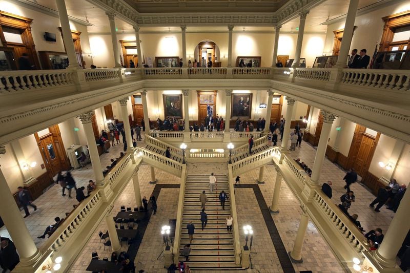 Lawmakers, lobbyists, staff, and members of the public fill the three floors of the Georgia State Capitol during Legislative Day 40 on Thursday night, March 29, 2018, in Atlanta. PHOTO / JASON GETZ