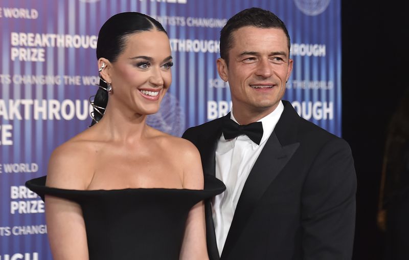 Katy Perry, left, and Orlando Bloom arrive at the tenth Breakthrough Prize Ceremony on Saturday, April 13, 2024, at the Academy Museum of Motion Pictures in Los Angeles. (Photo by Jordan Strauss/Invision/AP)